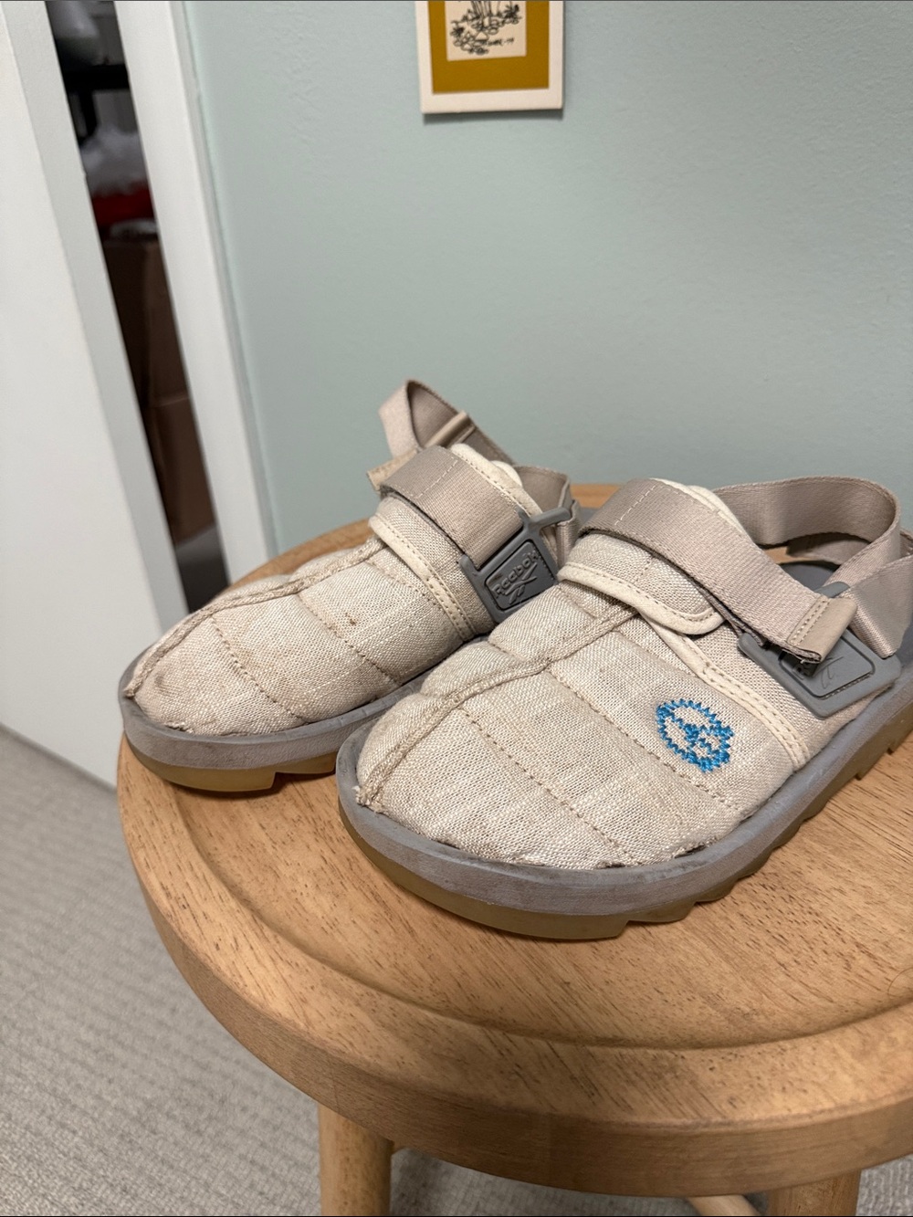 Reebok Beige Slip-On Sandals with Blue Logo Accent